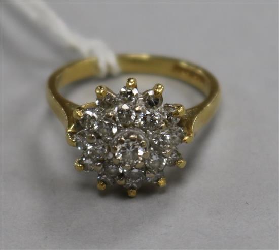 An 18ct gold and diamond cluster dress ring, size L.